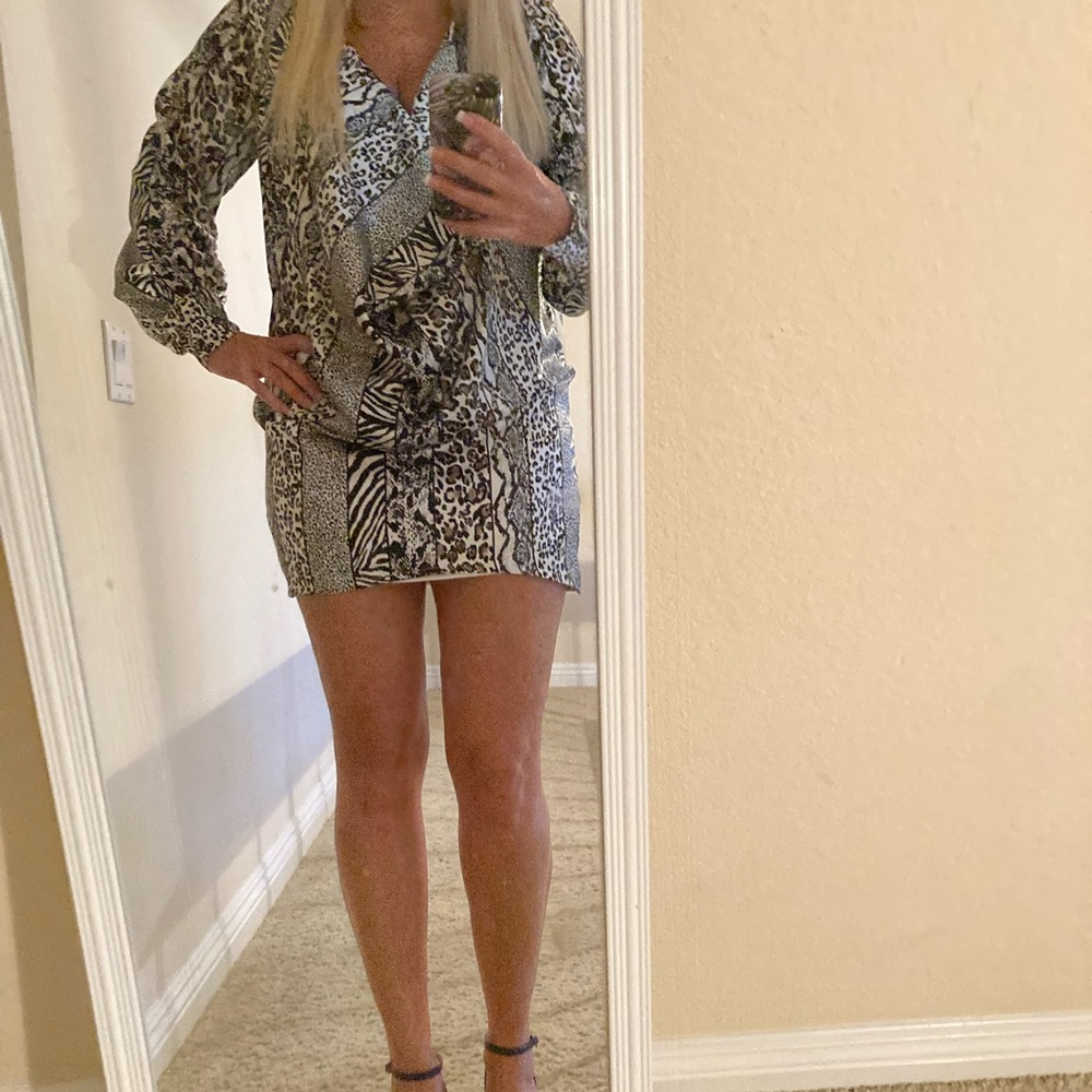 Bebe animal printed short dress with low draping front.